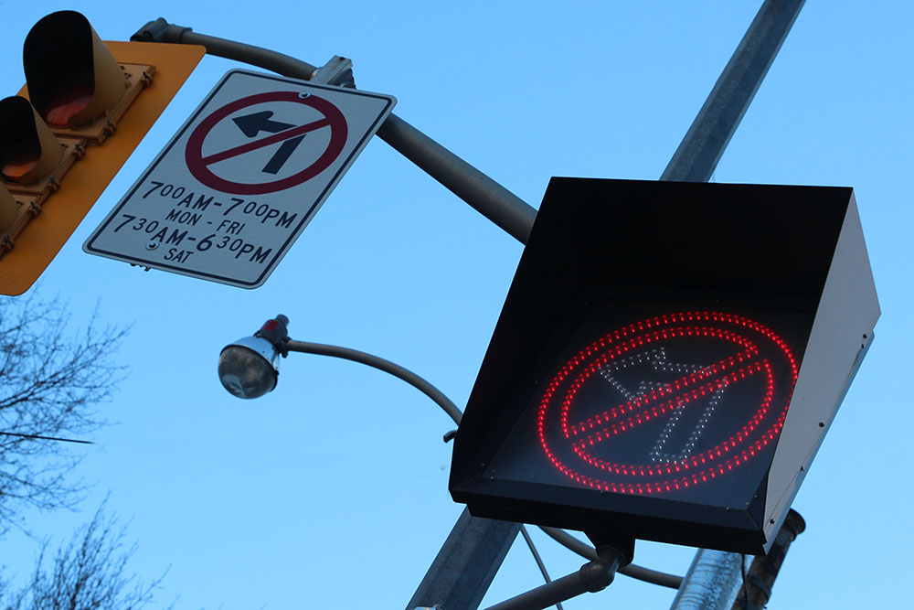 Signage for no right/left turn in the city of Toronto Orange Traffic